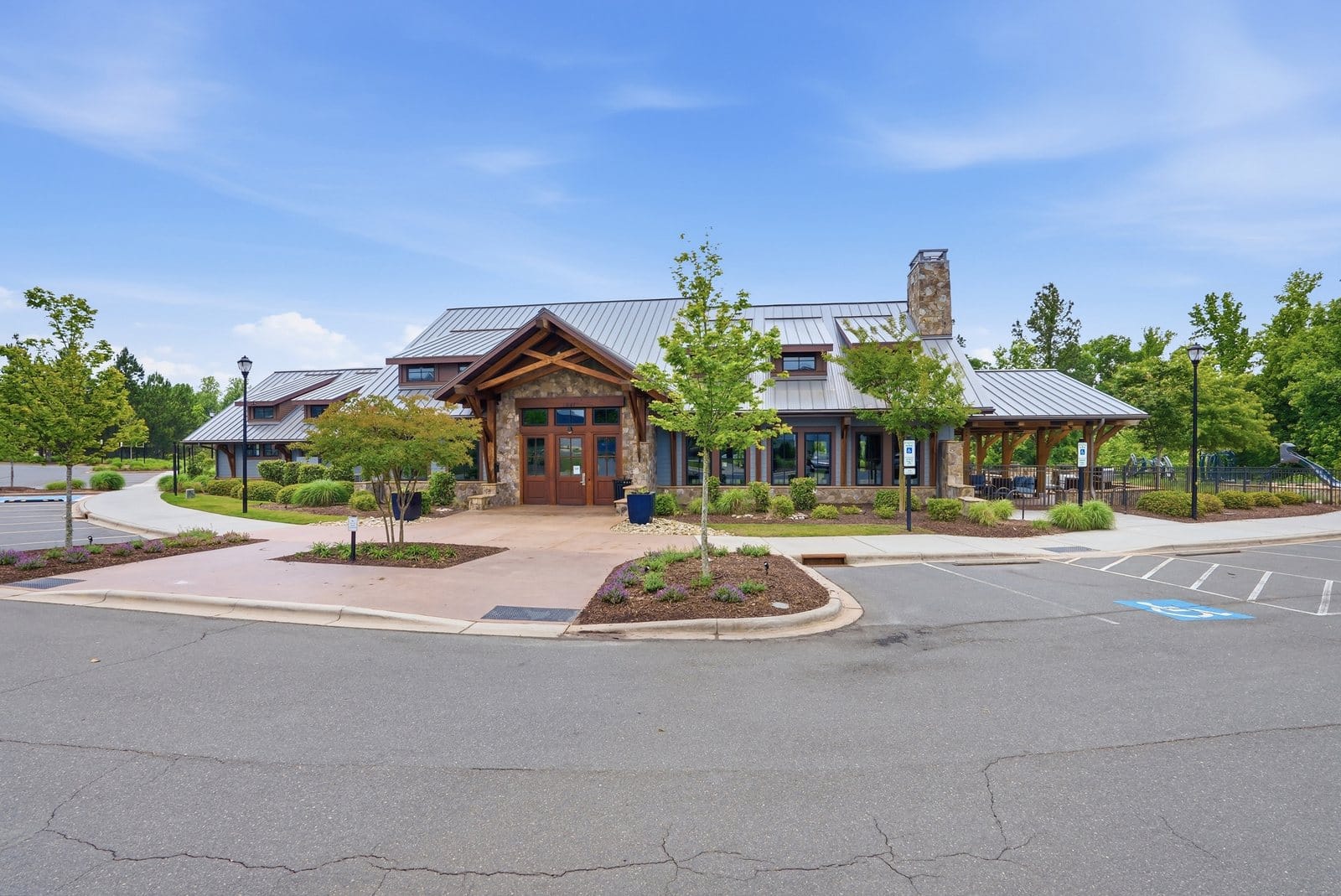 The clubhouse covered patio with a stone fireplace